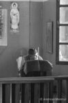 a monk looking outside a window